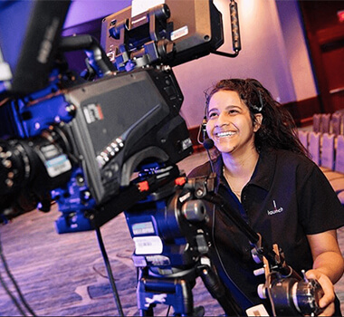 The Launch Group's video operator filming a general session event.